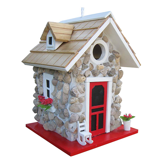 The Backyard Naturalist has whimsical yet functional bird houses in many styles, including this charming Stone Cottage with river stone facade, red screen door, window box with flowers and a rocking chair on the 'porch'.