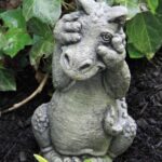 The Backyard Naturalist has concrete garden statuary—cast and hand-painted in USA, like the Little Peek-a-boo Dragon.