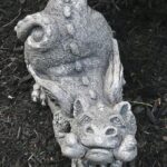 The Backyard Naturalist has concrete garden statuary—cast and hand-painted in USA, like the Little Peek-a-boo Dragaon.